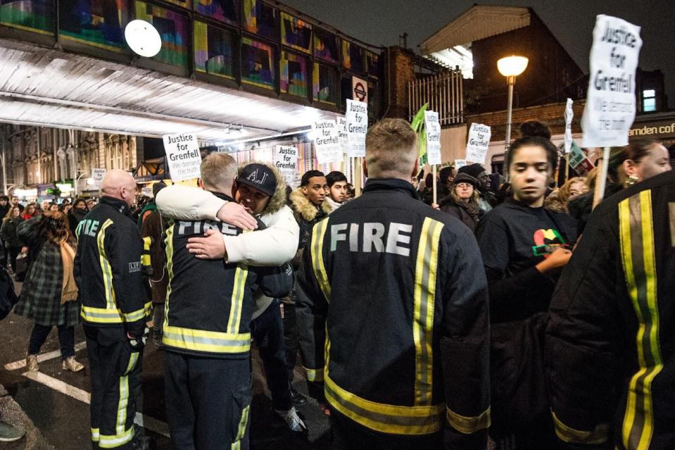  Firefighters who attended the Grenfell Tower disaster are hugged at a silent march honouring victims last night