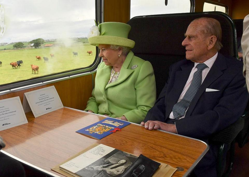  Queen Elizabeth and Prince Philip travelling on a steam train in Northern Ireland