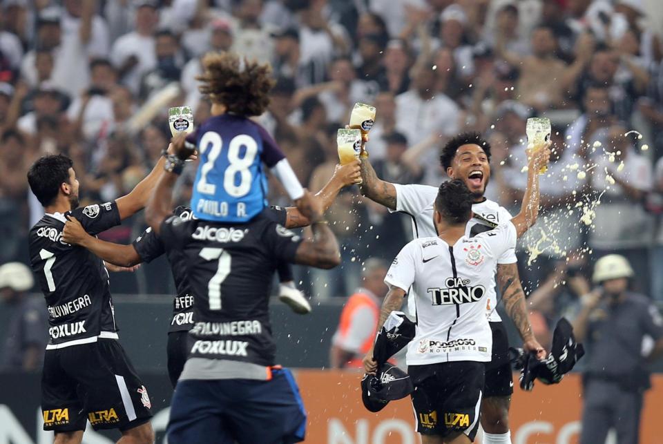  Ex-Prem star Kazim-Richards celebrates with a pint of lager