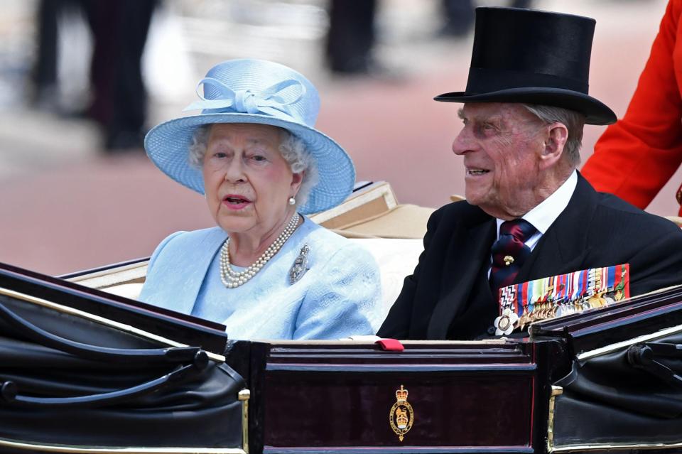  The Queen and Prince Philip travel in a horse-drawn carriage to Buckingham Palace after attending Trooping the Colour in June