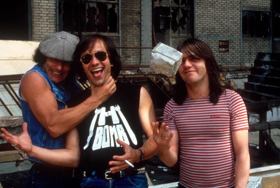  Young, centre, pictured with his AC/DC bandmates in 1984