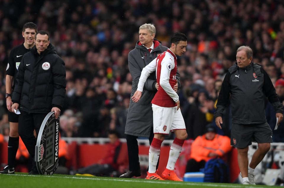  Mesut Ozil is replaced by Arsene Wenger during derby win over Tottenham