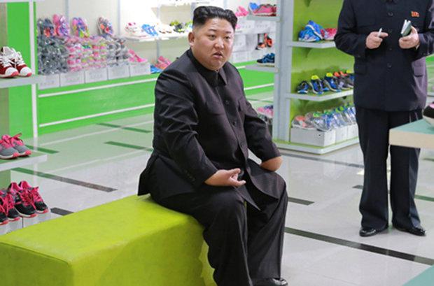  Kim Jong-un looks distressed as he sat at a shoe factory