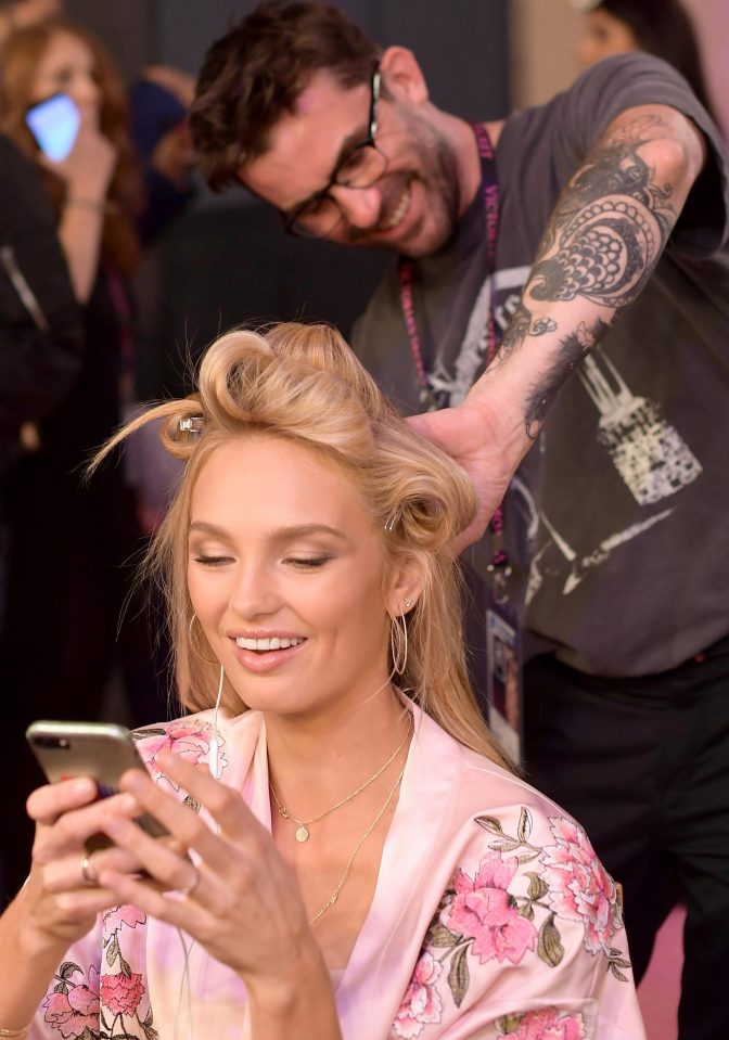  Model Romee Strijd looked at her phone as she got her hair done