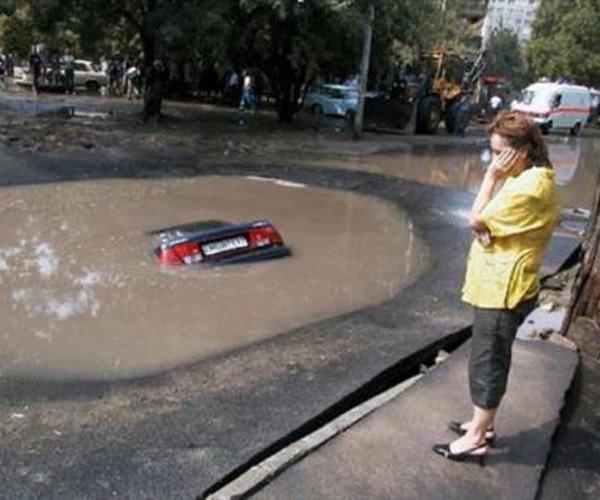  This driver wants the world to swallow her up ...after her car went the same way