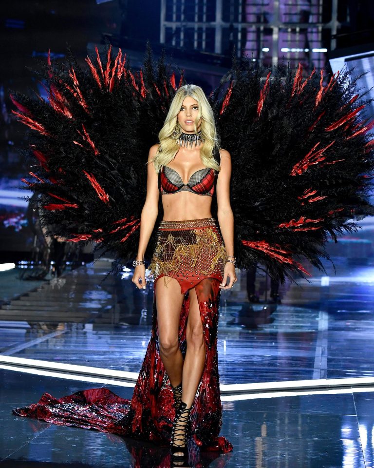  Devon Windsor wore a sultry black and red ensemble complete with dipped-hem skirt and vampish feathered wings