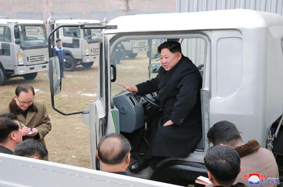  The tyrant grinned as he addressed reporters and workers