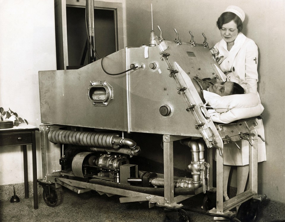 A nurse tends to a patient in an iron lung in this file image. The devices were once much more common 