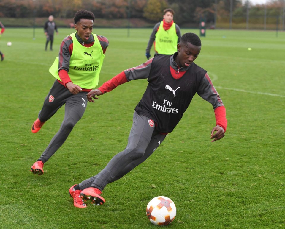  Joe Willock chases after Eddie Nketiah who are both pushing for a start