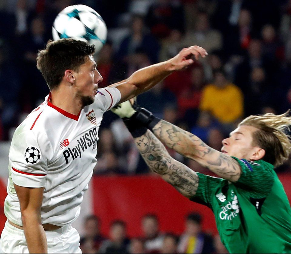  Lenglet vies for the ball with Liverpool keeper Loris Karius in the Champions League