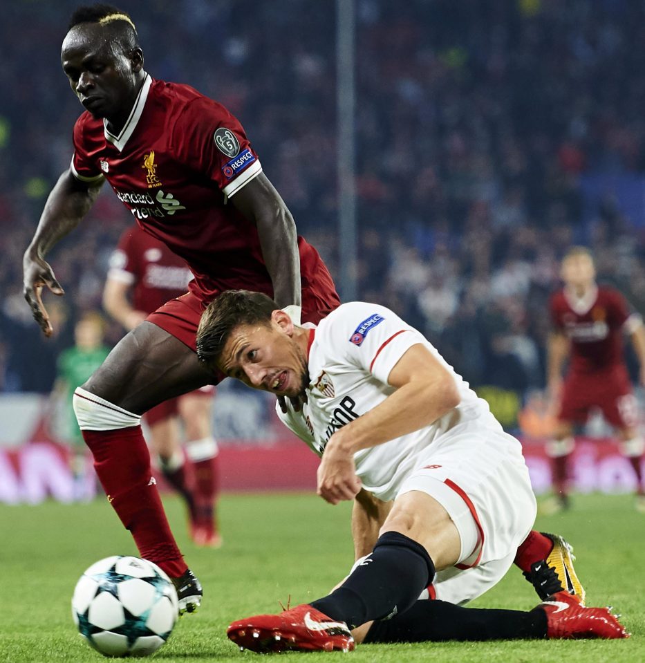  Lenglet tangles with Liverpool attacker Sadio Mane