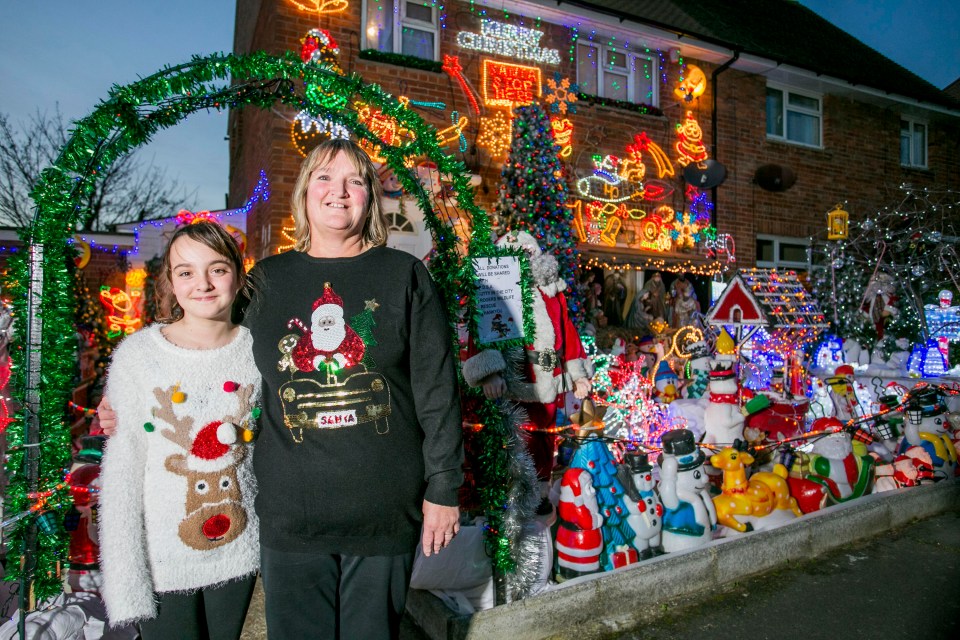 The festive scene also features four life-size reindeer and eight Christmas trees