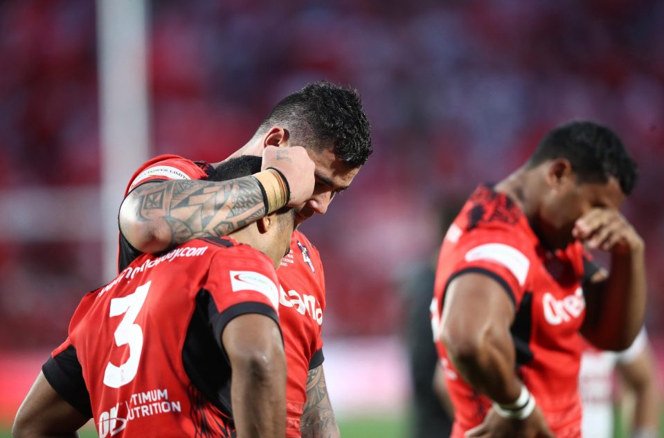  Michael Jennings and Andrew Fifita of Tonga console each other following Tonga's defeat