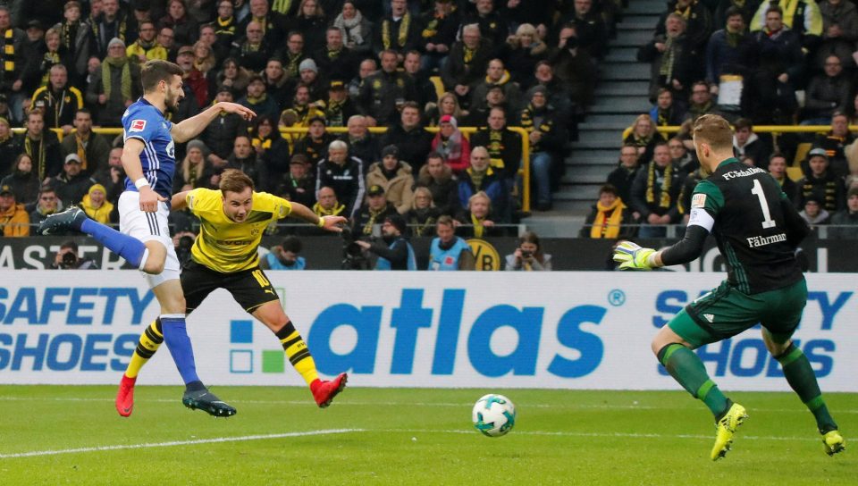  Attacking midfielder Mario Gotze fires the third Dortmund goal against Schalke