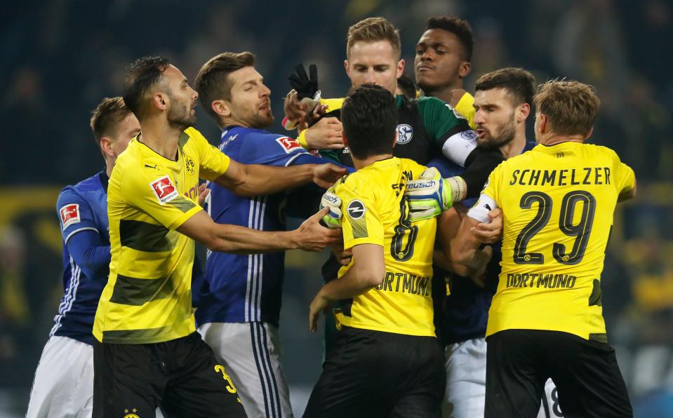  Tempers flare between Dortmund's Nuri Sahin and Schalke keeper Ralf Faehrmann