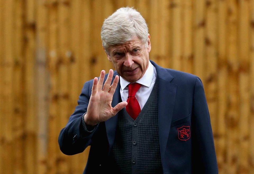  Arsene Wenger waves to the fans as he rushes into the stadium