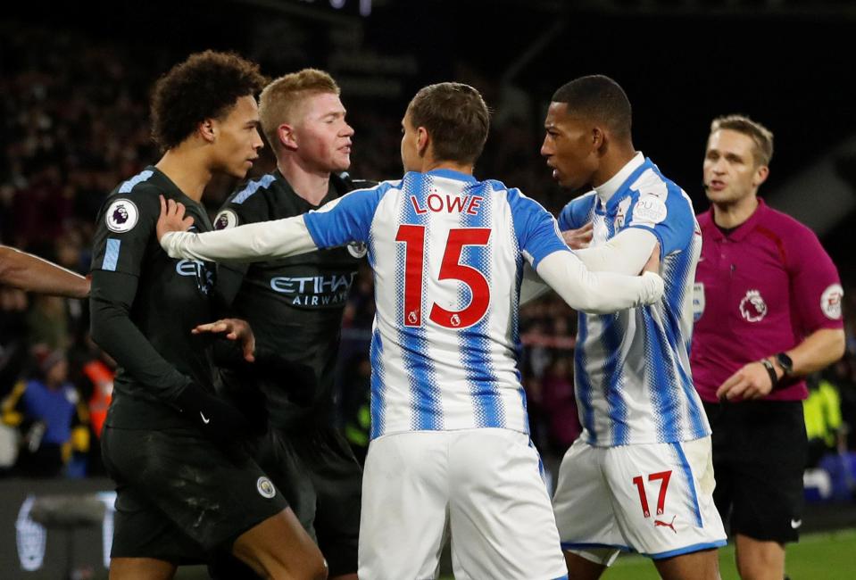  Players from both teams rush into separate Sane and Van la Parra