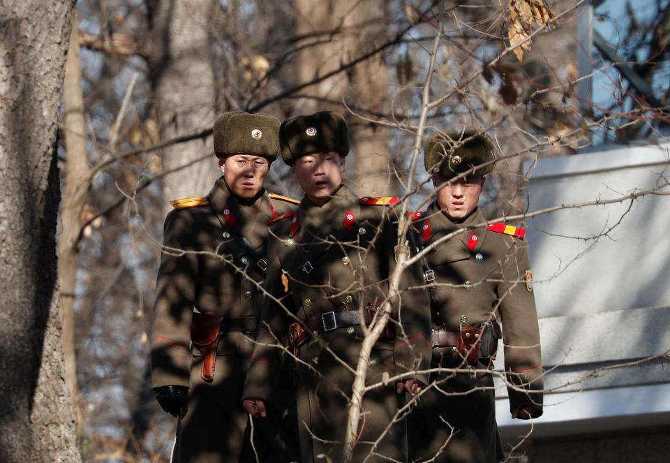  North Korean guards on the border at the 'peace village' Panmunjom, where a soldier was filmed escaping last week