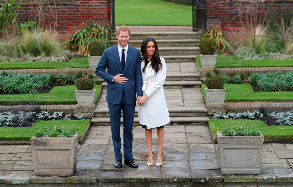 Meghan didn’t let go of Harry’s hand as they stood in front of photographers today