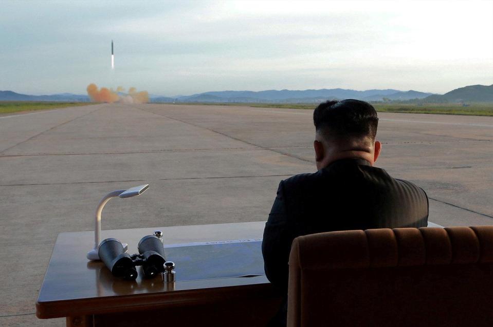  Kim Jong-un watches a previous missile launch in this undated handout photo