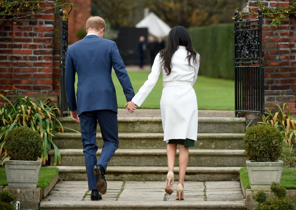 The lovebirds turned to walk back up the Sunken Garden steps