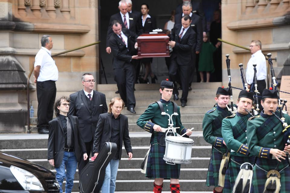  Malcolm Young's guitar 'The Beast' leads his coffin out of church after his funeral today