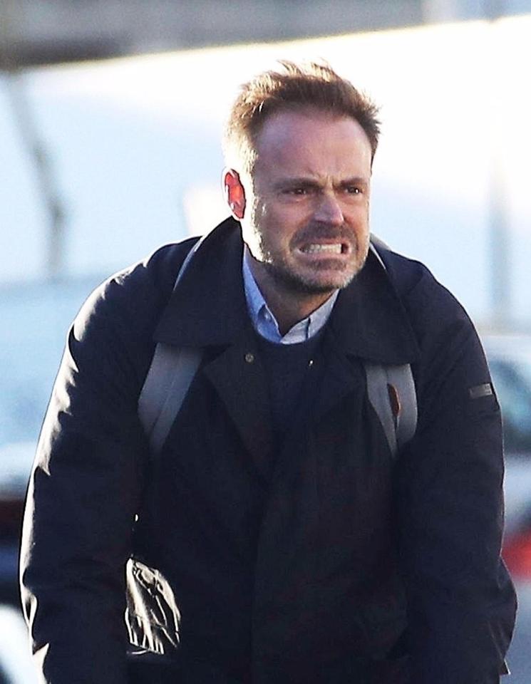  Jamie Theakston pulled a face while on his bike in London