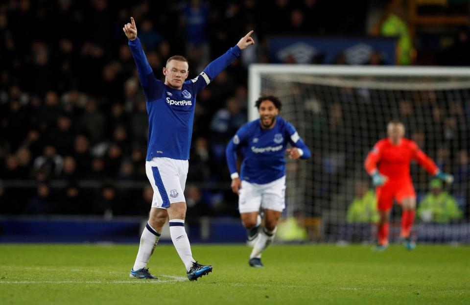  Rooney celebrates after completing a stunning hat-trick against West Ham