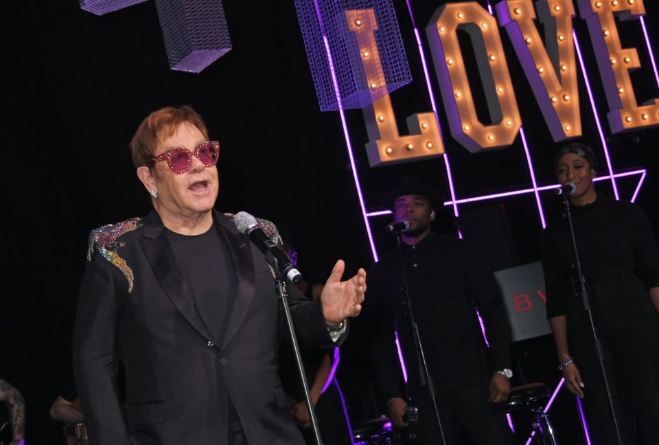  Elton John couldn't resist getting on the microphone at his own party