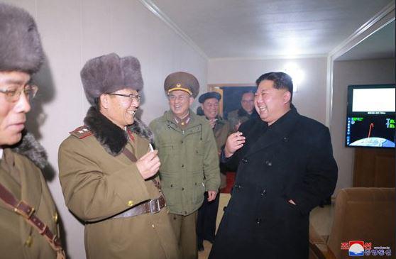  Kim has a cheeky smoke with his military cronies