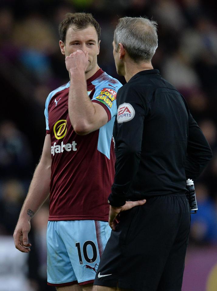  Burnley ace Ashley Barnes makes his point to referee Martin Atkinson