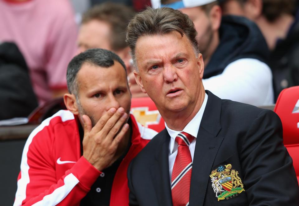  Ryan Giggs makes sure Louis van Gaal hears what he is saying