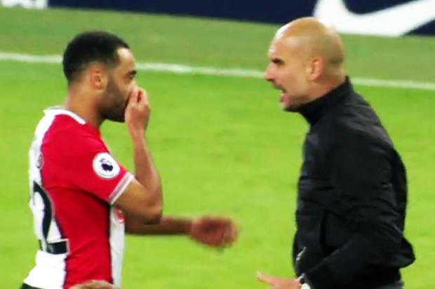  Nathan Redmond covers his mouth as he responds to the rant of Pep Guardiola