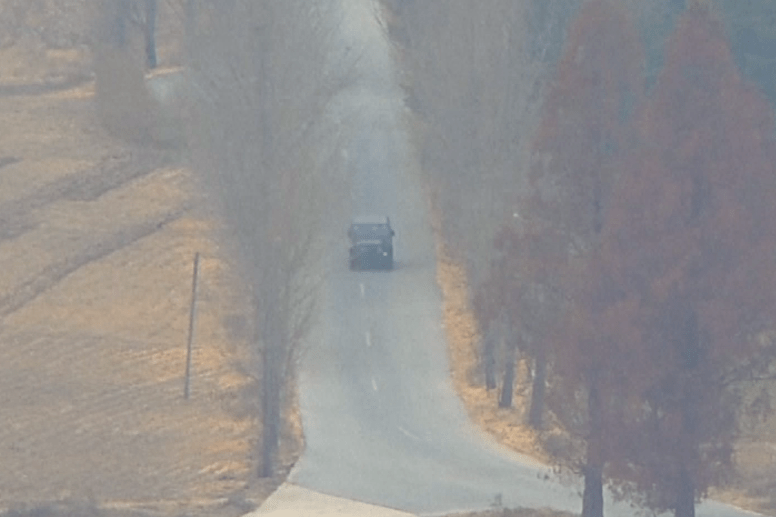  The defector's jeep can be seen speeding down the road towards the border