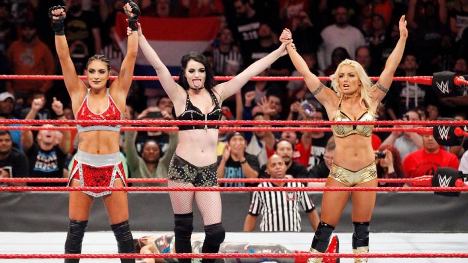  Paige with Sonja Deville and Mandy Rose after destroying the competition