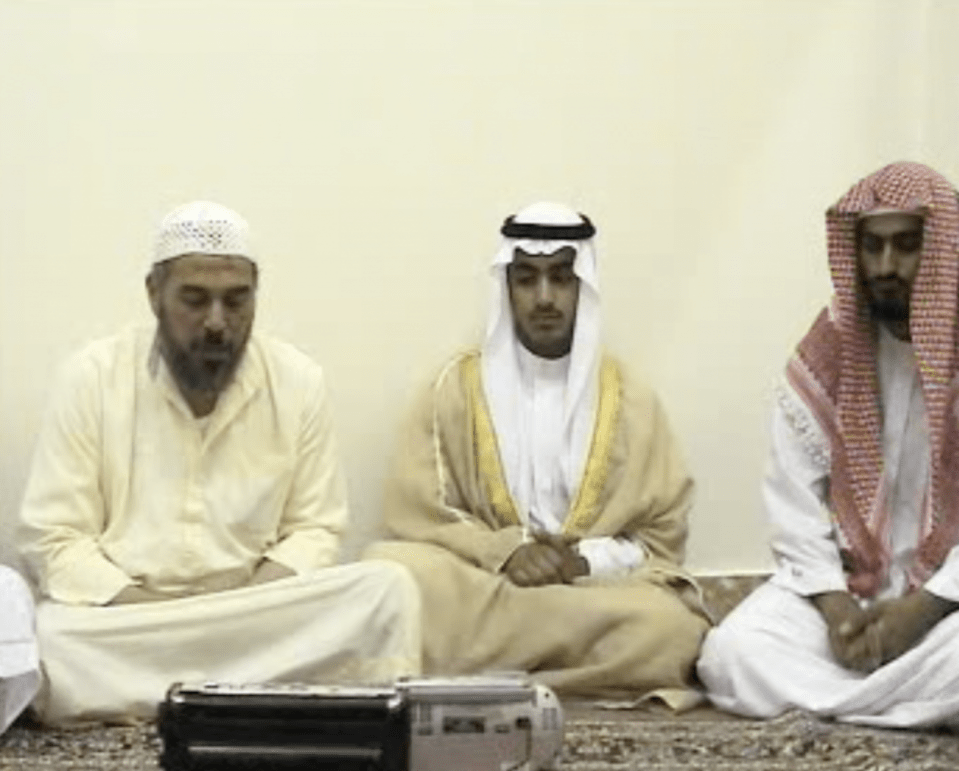  Bin Laden's son Hamsa (centre) at his wedding with senior Al Qaeda member Mohammed Islambouli (right)