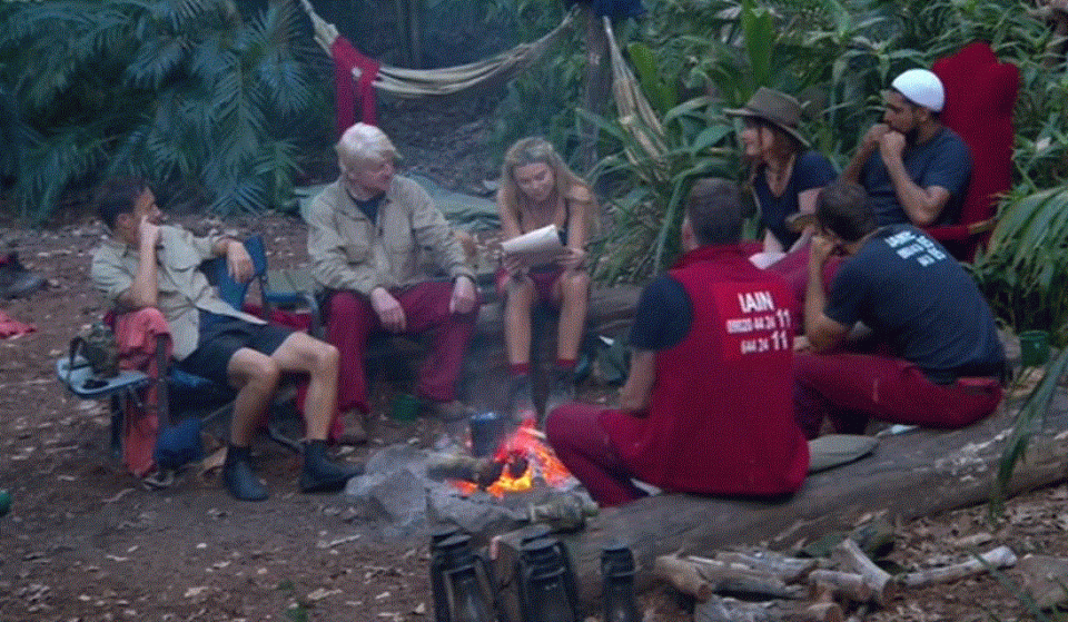  The group gathered around the campfire to read the letters