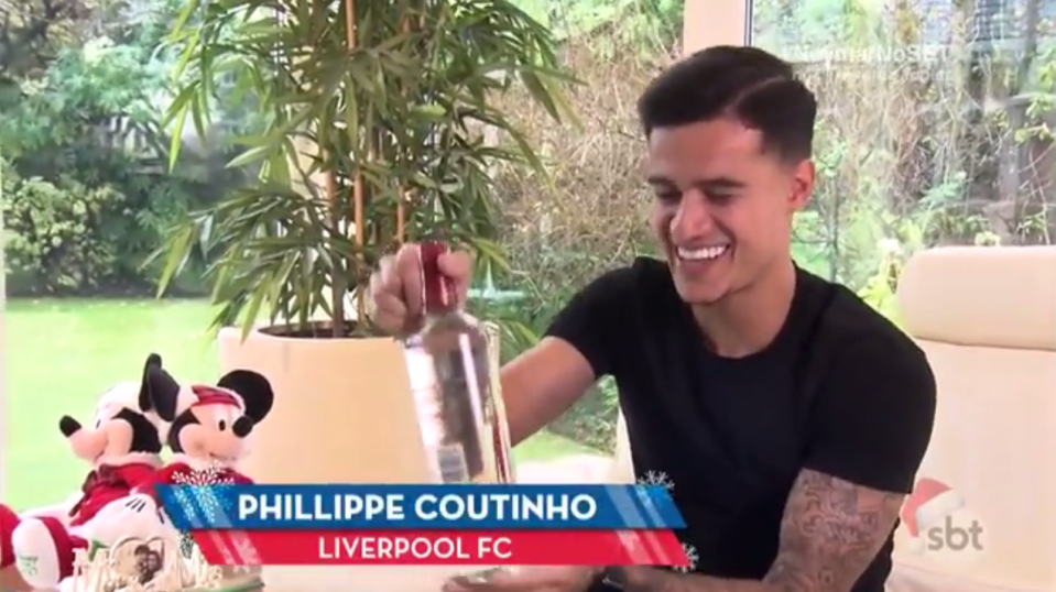  Philippe Coutinho is amazed to find he has been bought a bottle of vodka