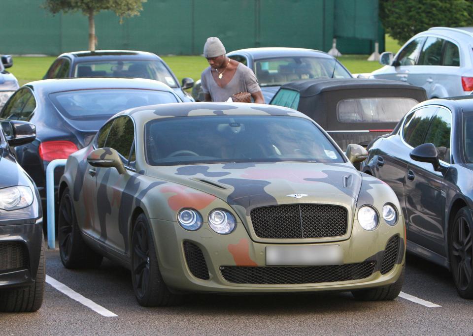  Super Mario Balotelli stands by his camouflage Bentley