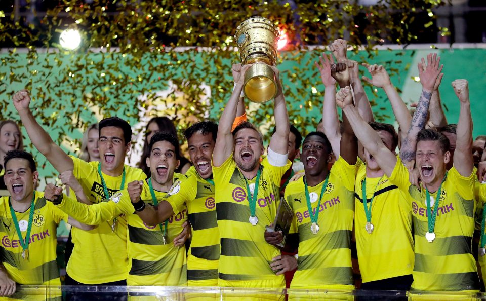  Dortmund's Marcel Schmelzer raises the German Cup after victory over Eintracht Frankfurt in May