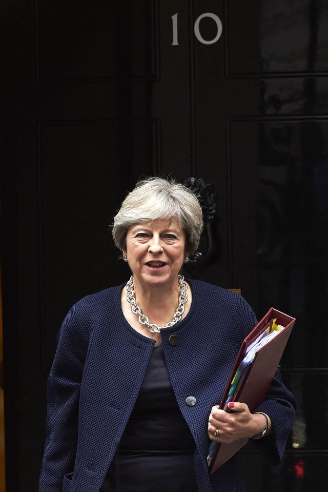  Theresa May's home at Downing Street is surrounded by security gates and protected by guards at Whitehall in Central London