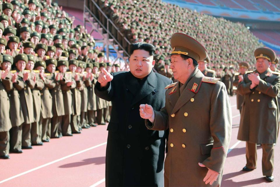  An image from two years ago shows Kim Jong-un with Hwang meeting military cadres