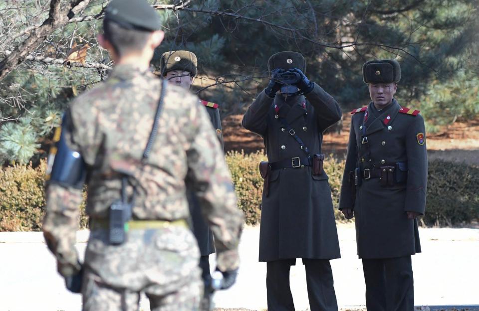  Tension between the two Koreas is high. Pictured are North and South Korean soldiers facing off at the border