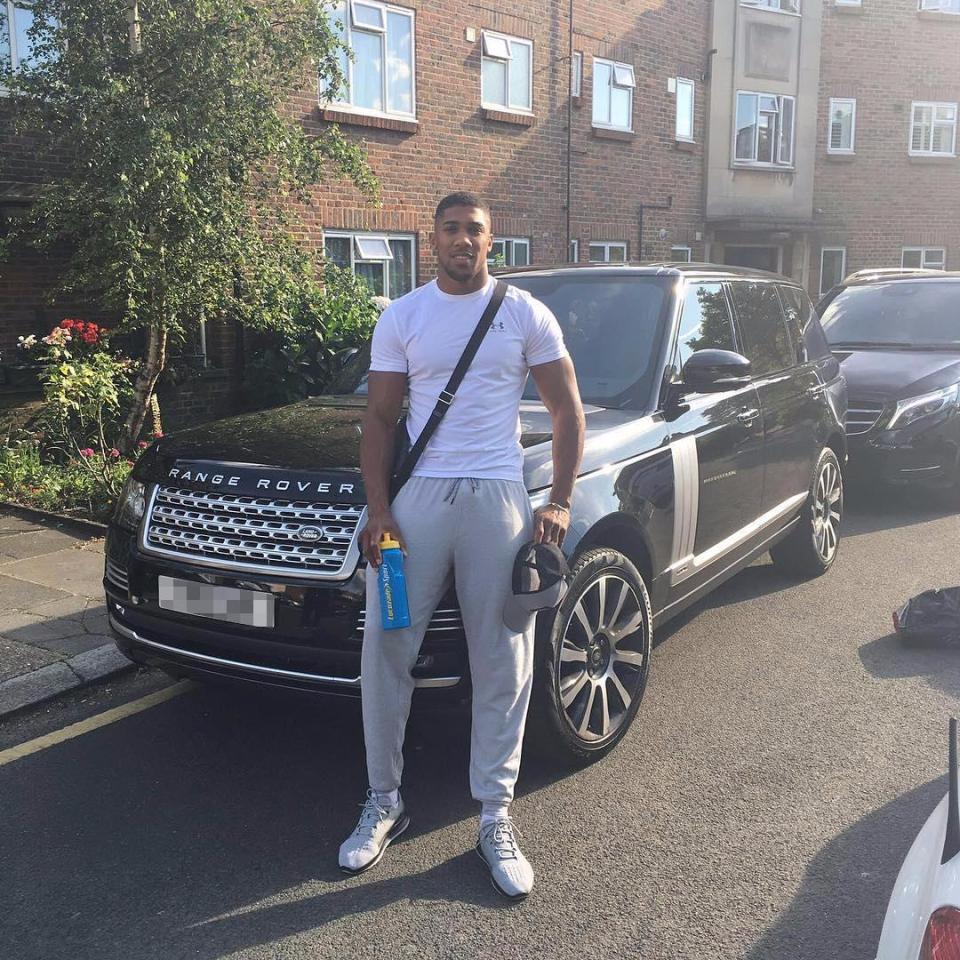  Anthony Joshua poses with his custom-made Range Rover