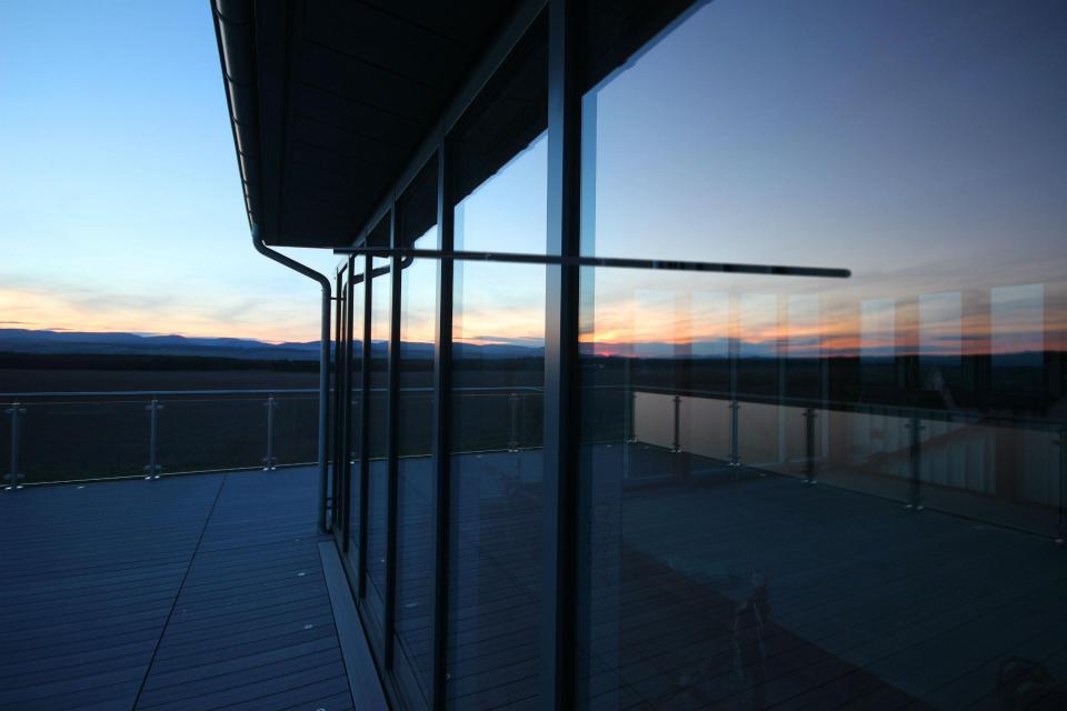  The spectacular roof terrace features glass balustrading as does the second floor balcony