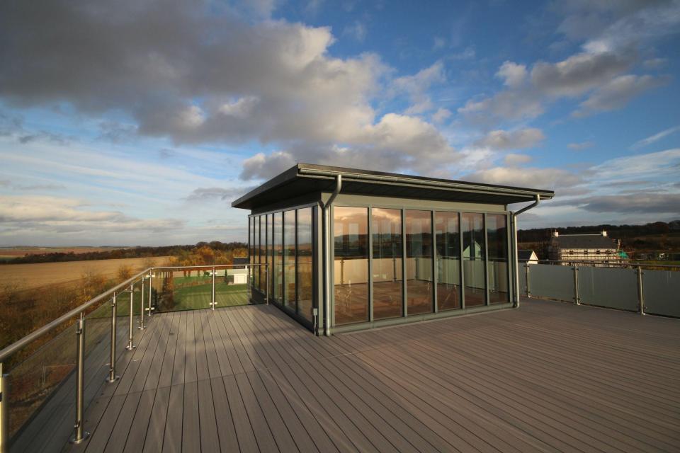  The roof boasts a dramatic sun room