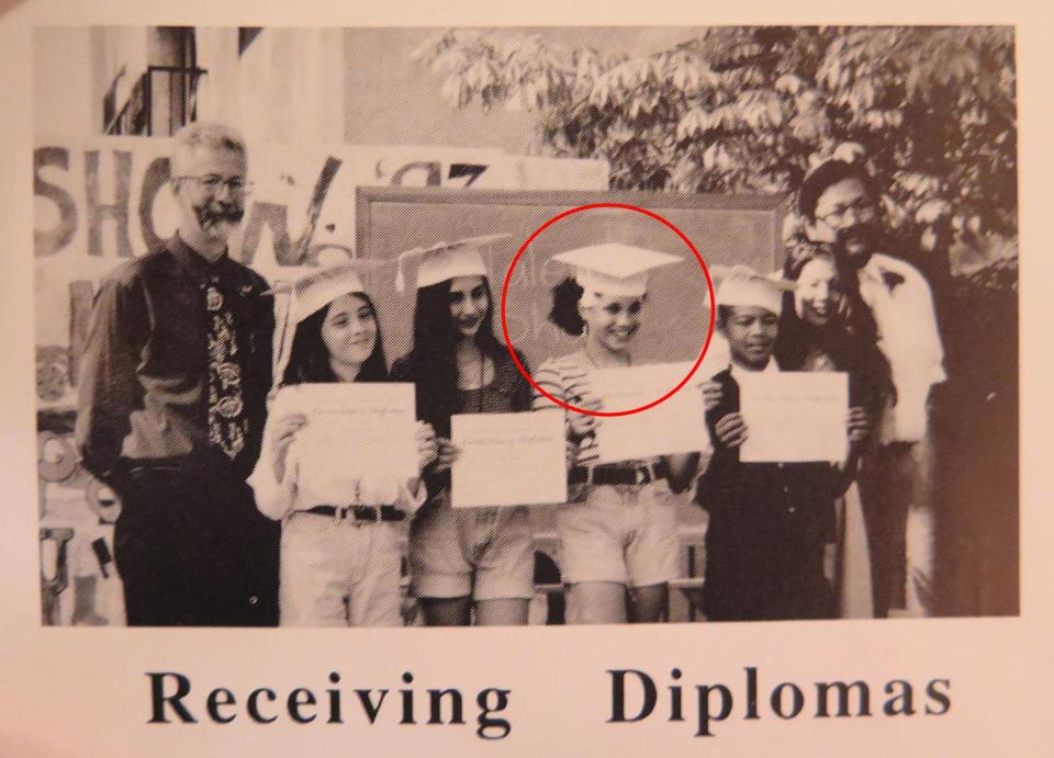  A vintage snap of Meghan in a mortarboard receiving her high school diploma