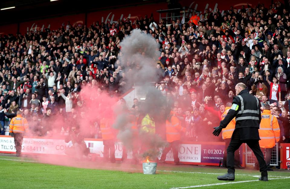  Fans threw flares onto the pitch during Bournemouth's game with Southampton