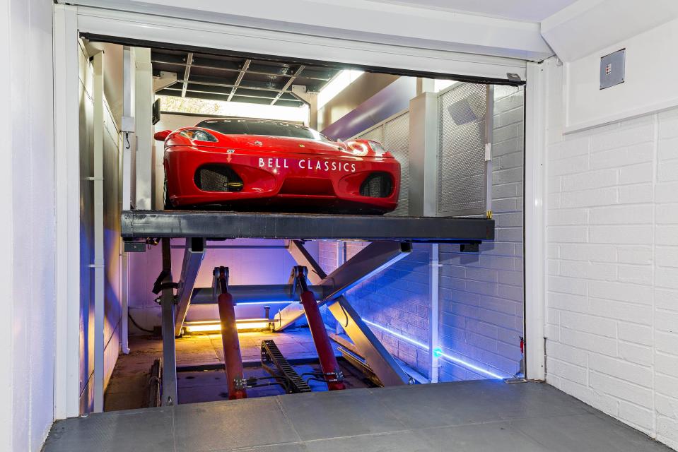  Hidden underground is a 1,000 square foot garage with a car lift