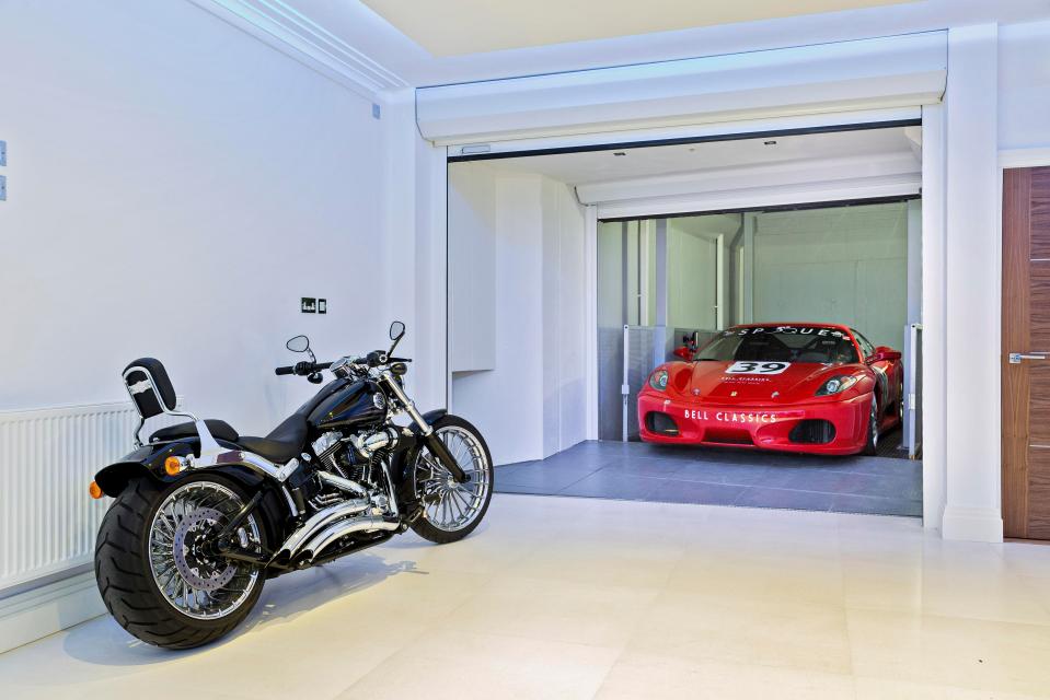  The garage boasts a white-tiled floor